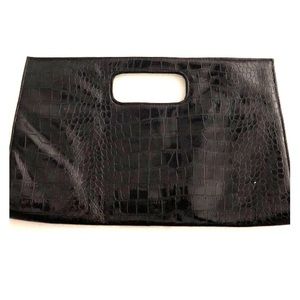 Black snap enclosure purse mad of faux leather